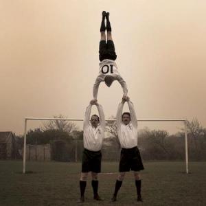 Acrobalancing footballers