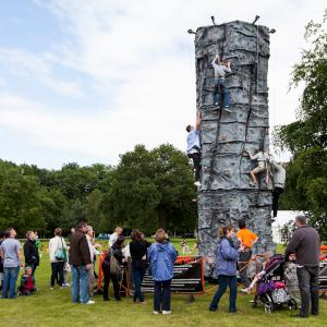 Mobile climbing wall available for team building events, corporate family days and outdoor events