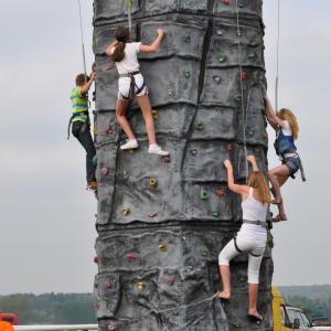 Mobile climbing wall available for team building events, corporate family days and outdoor events