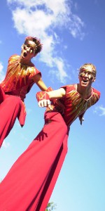 Cheeky red and yellow stiltwalking duo. Please quote floz4.
