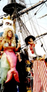 Mermaid on stilts with pirate. Please quote lemm1.