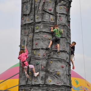 Mobile climbing wall available for team building events, corporate family days and outdoor events