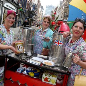 Comedy Tea Ladies distributing cups of tea